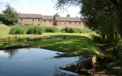 Retrofit settlement pond